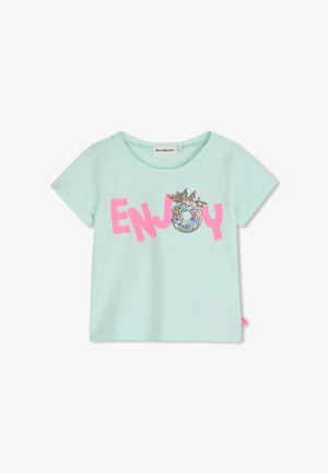 Maglietta a maniche corte per bambini di colore azzurro chiaro con la scritta rosa "ENJOY" e un ananas con paillettes che sostituisce la lettera "O" sulla parte anteriore.