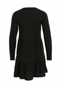 Robe noire à manches longues côtelées avec une taille basse et une jupe froncée, vue de dos sur fond blanc.