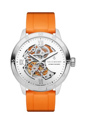 Hopeinen Seizmont-rannekello, jossa näkyvät mekaaniset rattaat, valkoinen kellotaulu, roomalaiset numerot, minuuttimerkinnät ja oranssi silikoniranneke.