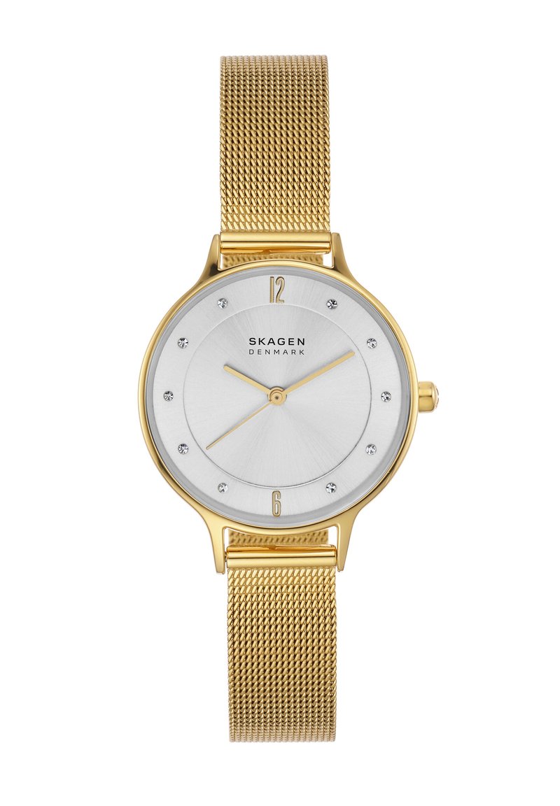 Gold mesh strap watch with a silver dial, featuring gold hour markers, three hands, and crystal accents at each hour position.