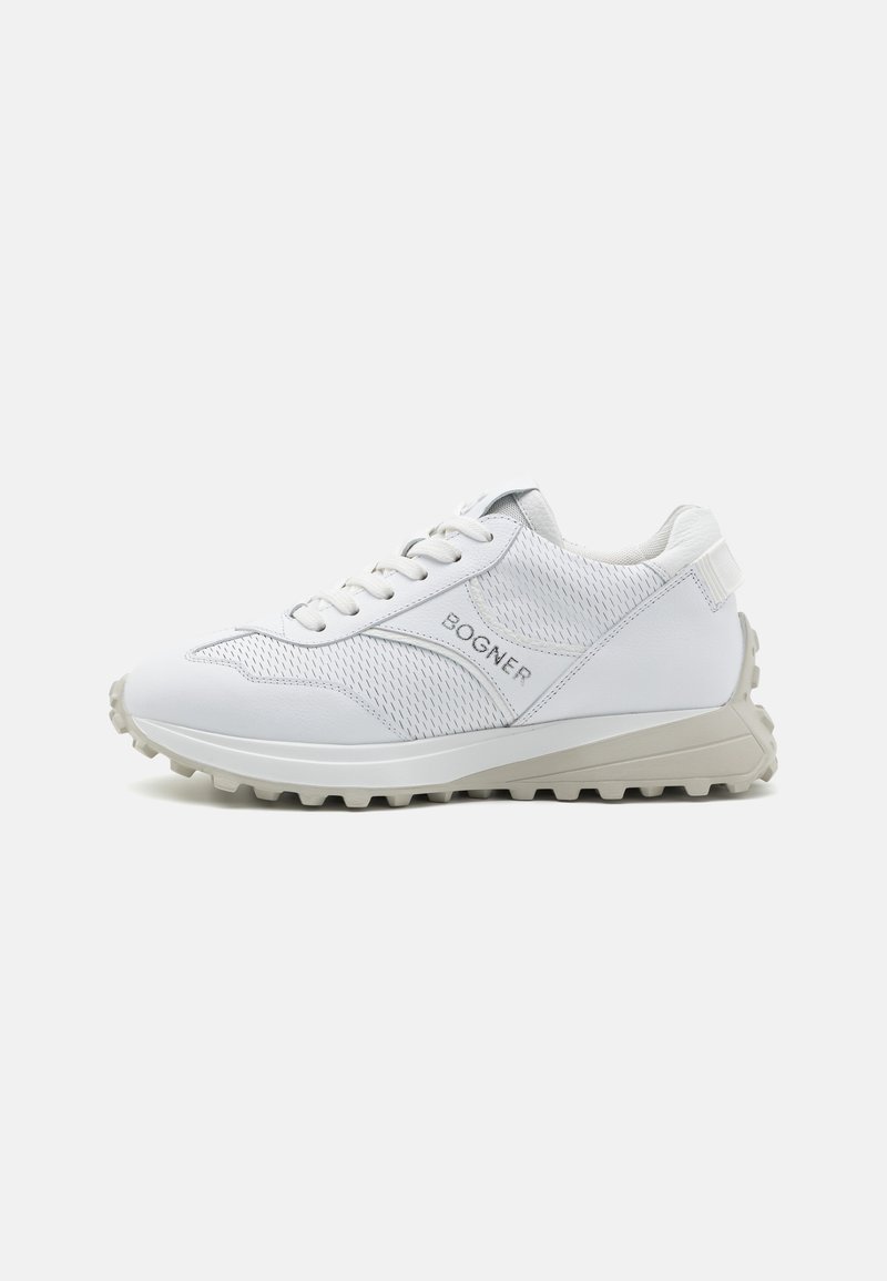 White athletic shoes featuring a mesh upper, rounded toe, gray accents, logo on the side, and a textured rubber sole.