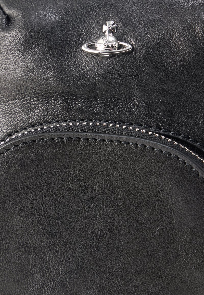 Black leather bag with a textured surface, featuring a silver planet and crown emblem. Accented with a silver zipper and stitching.