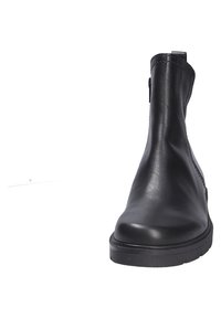 Bottine en cuir noir à la texture lisse, à bout rond et fermeture éclair sur le côté. Elle possède une semelle en caoutchouc plate et un design minimaliste.