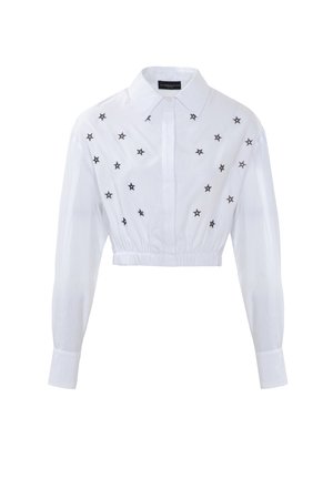 Witte cropped shirt met lange mouwen, voorzien van zwart sterrenborduurwerk aan de voorkant. Elastische tailleband en klassiek kraagontwerp.