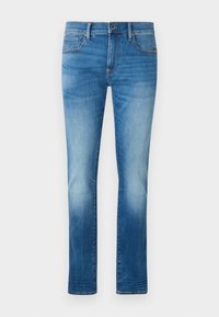 Jeans de denim azul desgastado con corte recto, cinco bolsillos y cierre de botón metálico. Diseño clásico con sutiles detalles de lavado.