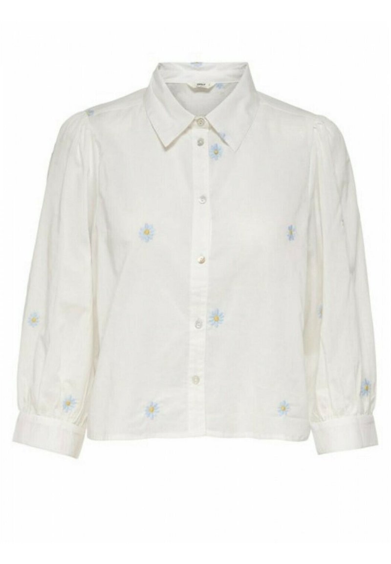 Blouse blanche à boutons avec manches bouffantes, ornée de broderies florales bleu clair. Confectionnée dans un tissu texturé, avec un col classique et des poignets.