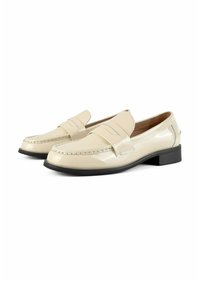 Beige patent leather loafers with a flat black sole, featuring a front strap design and subtle stitching details.