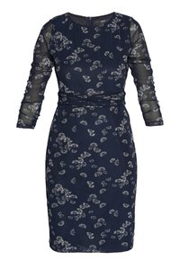 Marineblaues Kleid mit langen, transparenten Ärmeln, weißer Blumenstickerei, anliegender Silhouette und Rundhalsausschnitt mit Reißverschluss am Rücken.