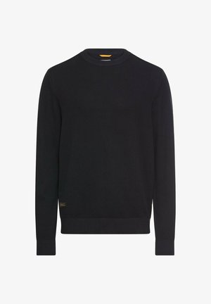 Zwarte gebreide trui met ronde halslijn, geribbelde manchetten en zoom, voorzien van een getextureerd patroon. Kleine logodetail aan de onderkant.