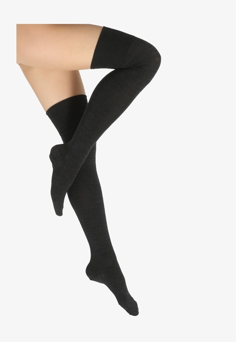 Black over-the-knee socks made of a soft textured fabric with ribbed cuffs, featuring a smooth finish and contoured shape.