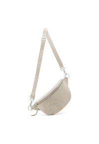 Borsa a tracolla in suede beige con forma arrotondata, scomparto con zip e tracolla regolabile, con "EXPATRIÉ" impresso in bianco.