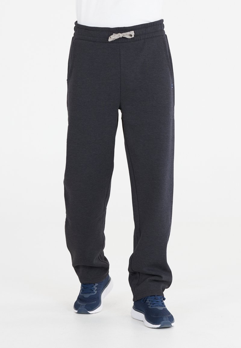 Mörkgrå sweatpants i mjukt tyg, med dragsko i midjan, sidofickor och avslappnad passform. Lämpliga för avslappnad användning.