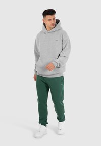 Smilodox CASUAL SPORT FIERO - Trainingsbroek - grün