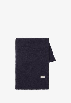 Ponge blu scuro, coperta texturizzata con una sensazione morbida. Piegata, presenta un piccolo tag rettangolare con il logo "THINKING MU" su un bordo.