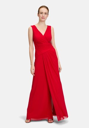 Rotes bodenlanges Kleid mit V-Ausschnitt, gerafftem Oberteil und schwingendem Rock. Glatter Stoff und elegante Silhouette mit einem seitlichen Schlitz.