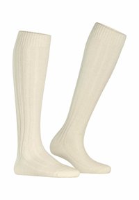 Calze al ginocchio di colore crema chiaro. Realizzate in tessuto a coste, presentano una texture liscia e una parte superiore elastica per una vestibilità sicura.