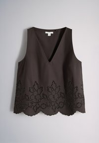 Sleeveless black top with deep V-neck and floral cut-out lace pattern along the scalloped hem, displayed on a plain light background.
