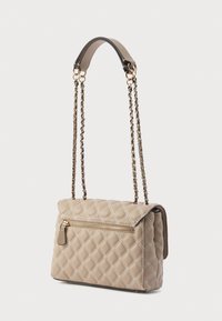 Quilted beige handbag with a flap closure, featuring a front zipper pocket and dual chain straps with a leather shoulder pad.