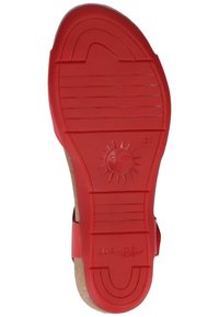 Rode rubberen zool met patroon van gripgroeven en een zonembleem. Kenmerkt "COSMOS comfort" branding en maat "37" gegraveerd.