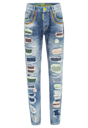 Blue denim jeans featuring a slim fit, distressed sections, colorful embroidery, contrasting stitching, and multiple patch details.