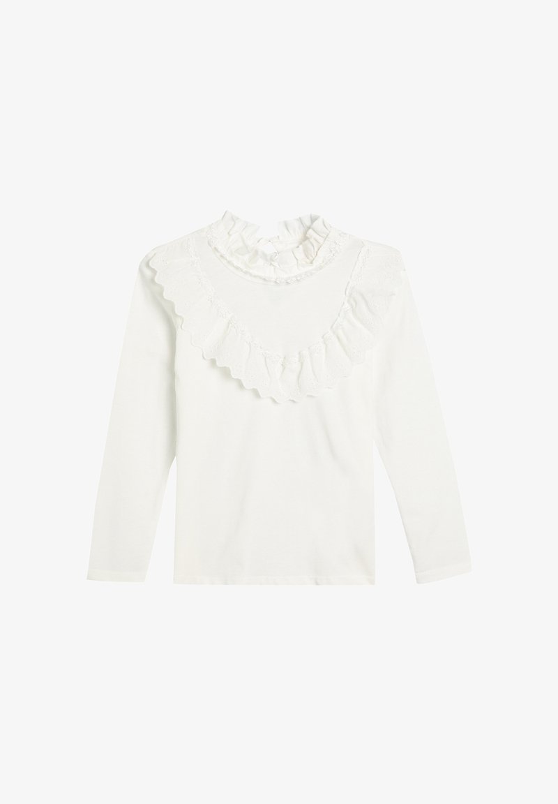 Biała bluzka z długim rękawem, z falbaniastego, wysokiego kołnierza i ozdobiona koronkową falbanką na wysokości klatki piersiowej oraz ramion.