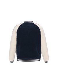 Fleecejakke med en marineblå ryg, cremefarvede ærmer og stribede ribkantede manchetter. Materialet har en tekstureret, blød finish.