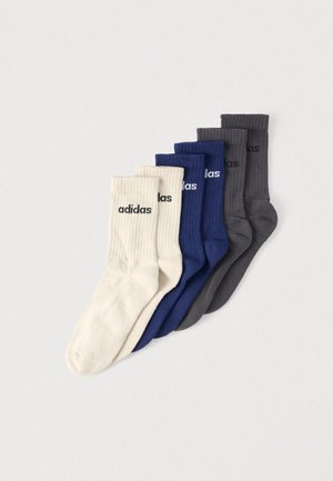 Set de cinci perechi de șosete din bumbac în culorile crem, bleumarin și gri închis, cu textură rib și logo-ul „adidas” negru pe lateral.
