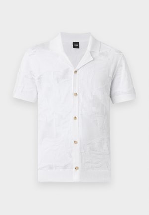 Wit gebreid shirt met korte mouwen en een subtiel textuurvol bloemmotief met zes beige knopen aan de voorkant, voorzien van een kraag en een geribde zoom.