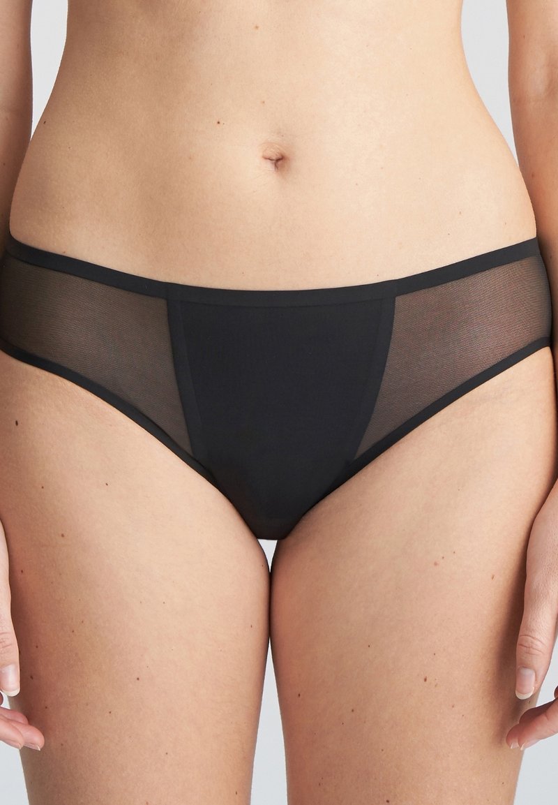 Zwarte boxershort van ondoorzichtig materiaal met doorschijnende meshnaden aan de zijkanten. Voorzien van een gladde tailleband en naadloze randen voor maximaal comfort.