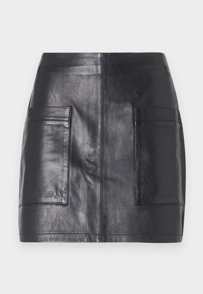 Black leather mini skirt featuring two side pockets, smooth texture, fitted design, and clean lines without additional embellishments.