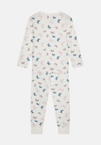 Cotton pajama set in cream featuring long sleeves and pants, decorated with an all-over print of pink, blue, and brown butterflies.