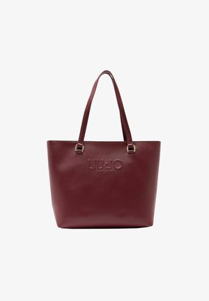 Burgunderfarbene Tragetasche aus strukturiertem synthetischem Material, mit geprägtem Logo und doppelten Schulterträgern. Verfügt über eine strukturierte Form und goldfarbene Hardware-Akzente.