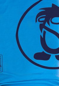 Blue cotton t-shirt featuring a large dark blue graphic of a cartoon character and logo on the front, with a tag on the bottom left.