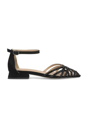 Scarpe flat in suede nero con cinturino alla caviglia, dotate di punta affusolata e un design incrociato decorato con paillettes nere. Tacco basso a blocco.