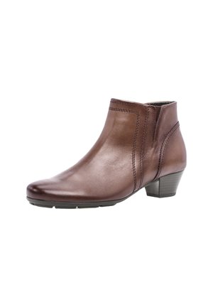Brown leather ankle boot with a rounded toe, subtle stitching details, and a low block heel, featuring a smooth texture and sleek design.