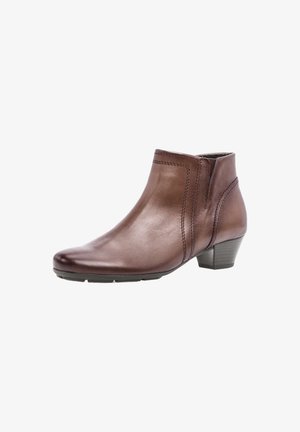 Braune Leder-Stiefelette mit runder Zehenpartie, dezenten Nähdetails und einem niedrigen Blockabsatz, ausgestattet mit einer glatten Textur und einem eleganten Design.