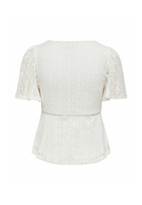 Blouse blanche en dentelle à manches courtes bouffantes et taille peplum, avec un motif délicat en forme de losange.
