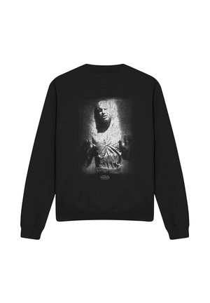 Schwarzer Sweatshirt mit einer weißen Grafik einer Person, die in einem strukturierten Block eingeschlossen ist, und kleinem "Star Wars" Text unter dem Bild.