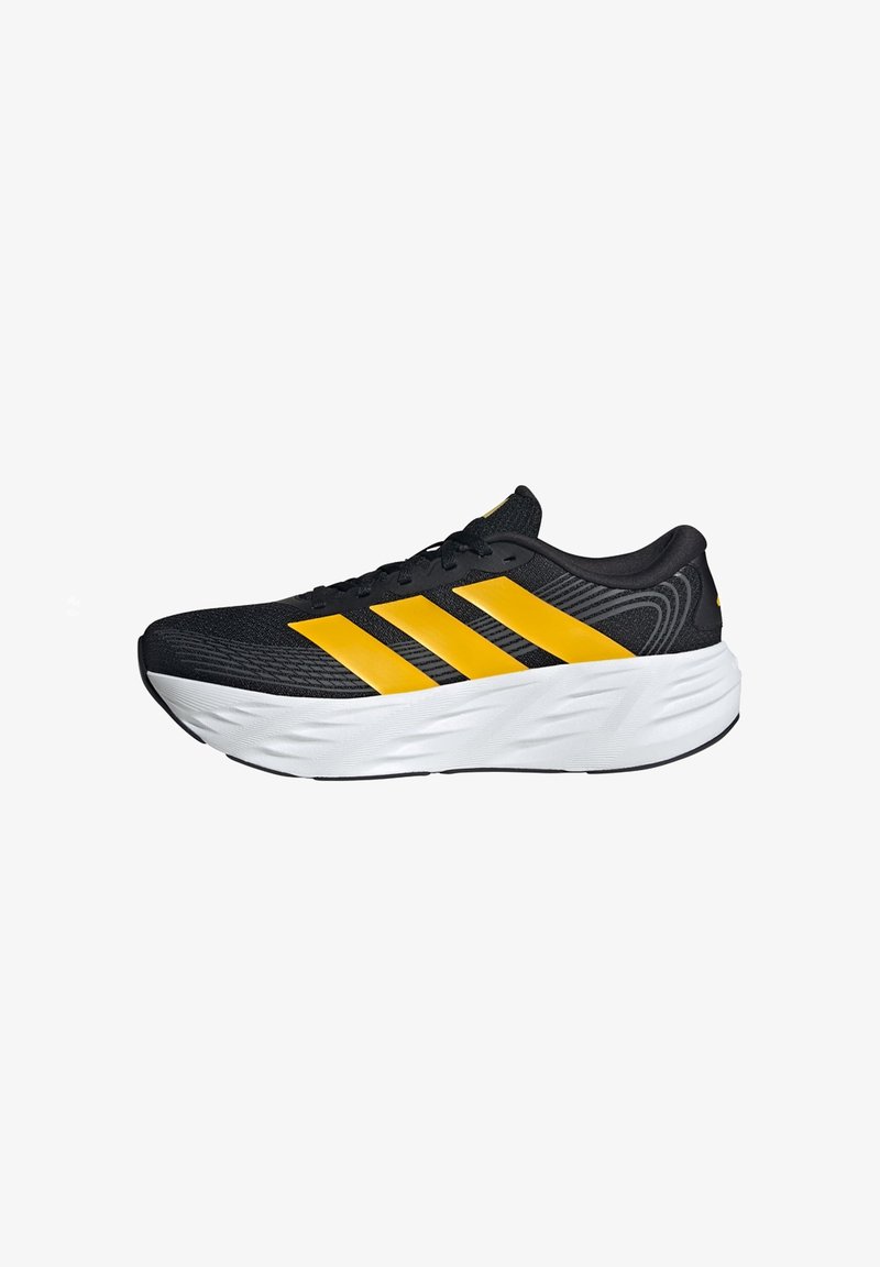 Black running shoe with three bold yellow stripes and thick white cushioned sole, side view on white background.