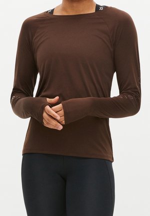 Brown long-sleeve active shirt with a smooth texture, featuring thumbholes in the cuffs and a round neckline. Accents on sleeves are visible.