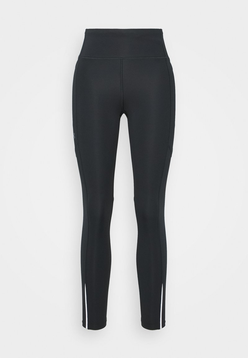 Leggings atléticos negros hechos de una tela elástica, con una cintura alta, costuras laterales y acentos blancos en la parte inferior de las piernas.