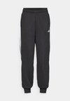 TIRO - Tracksuit bottoms - black/white