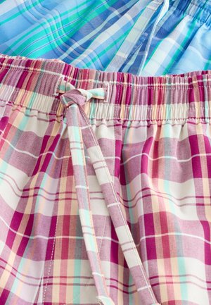 Mehrfarbige Karoshorts mit einem Muster in Pink, Lila und Mint, einem elastischen Bund und einer Knotenverschluss. Glattes Stoffgewebe.