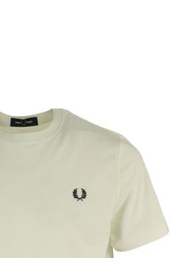 Cream-colored cotton t-shirt with short sleeves, round neck, featuring a black embroidered logo on the left chest. Smooth texture.