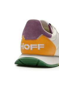 White sneaker with a purple suede heel tab, orange accent, and green outsole. Features white embroidered "HOFF" logo. Textured materials throughout.