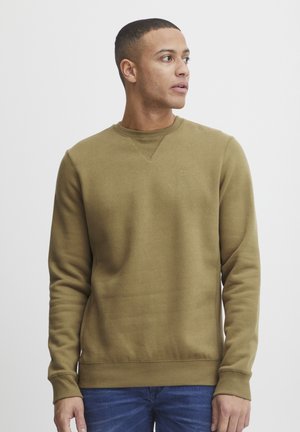 Olive green sweatshirt in a soft fabric, features a crew neckline, ribbed cuffs and hem, and a subtle logo on the chest.
