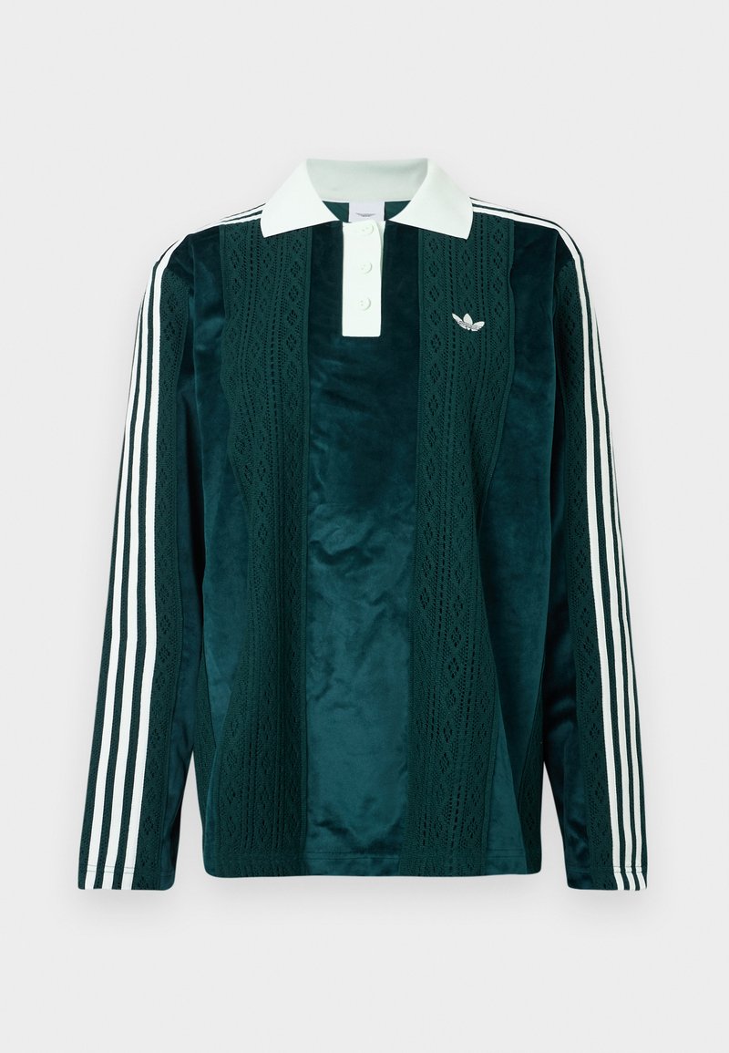 Long-sleeve polo in dark green velvet with white accents. Features three-button placket, embroidered logo, and three white stripes on sleeves.