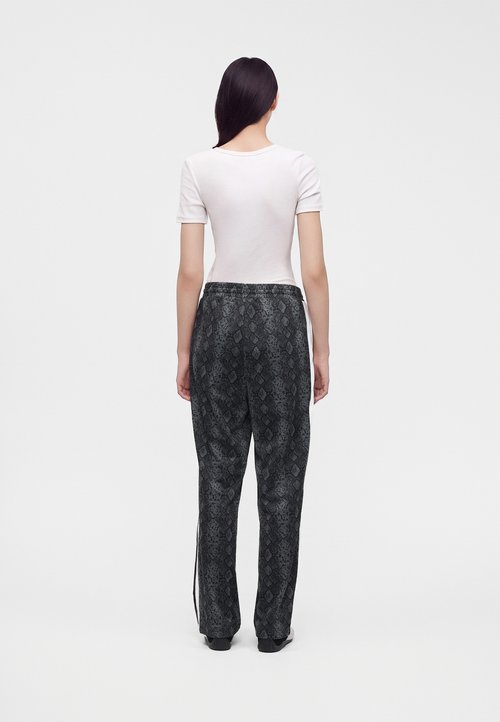 PUMA SNAKE STRAIGHT PANTS - Tracksuit bottoms - black — photo 3