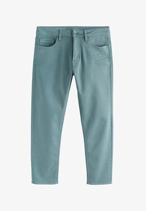 Pantalon bleu-vert pour homme, coupe slim, avec fermeture par bouton, poches avant, passants pour ceinture et une petite poche à monnaie sur le côté droit.