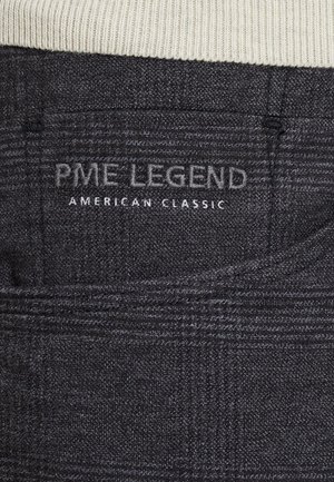 Dark gray fabric with a subtle pattern. Features "PME LEGEND" and "AMERICAN CLASSIC" embroidered on a back pocket.